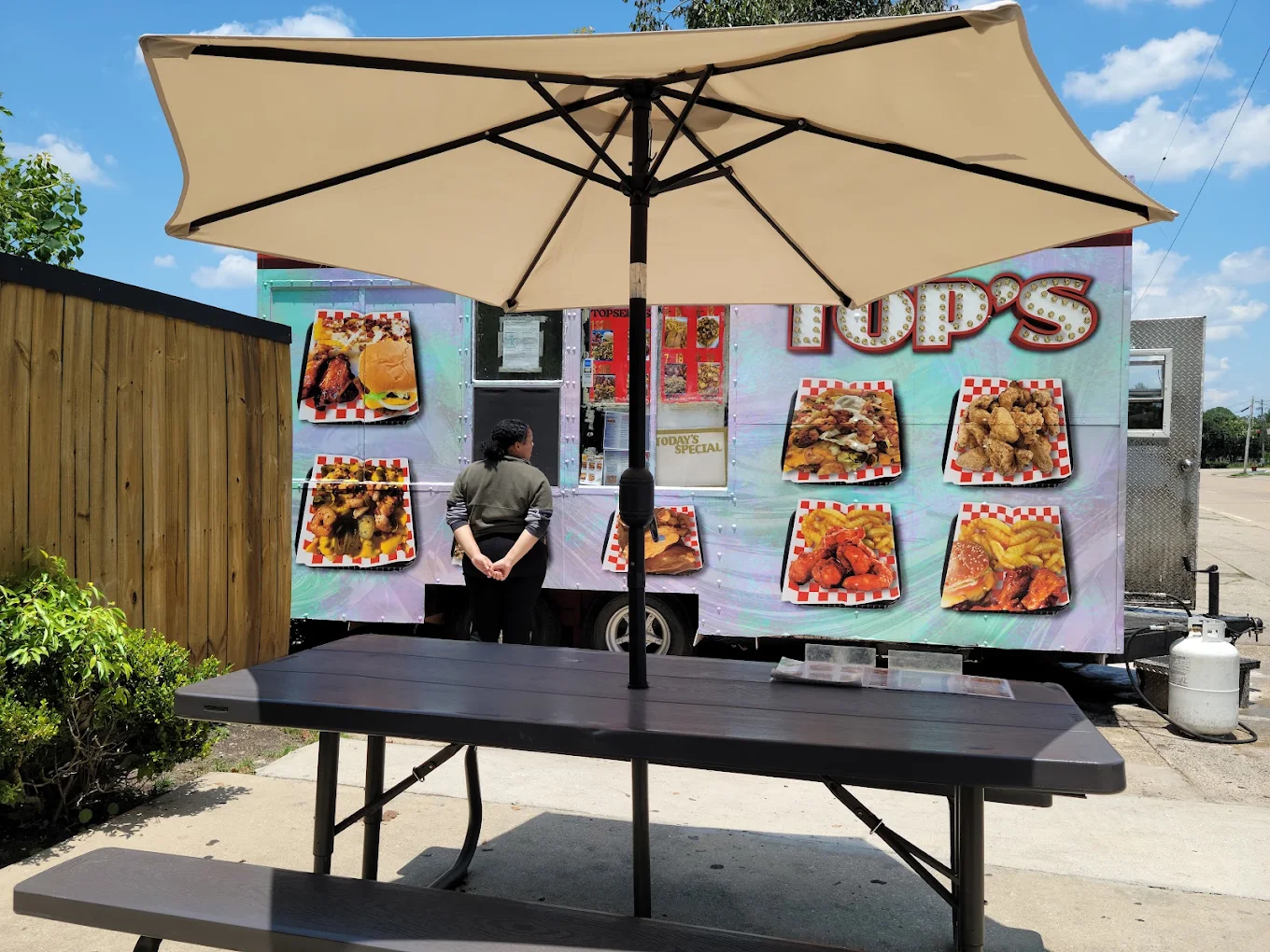 The Top's Food Truck parked on a Mobile, Alabama street at golden hour
